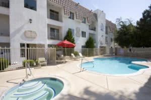 S shaped pool and hot tub at our Cameron location - Emerald Suites